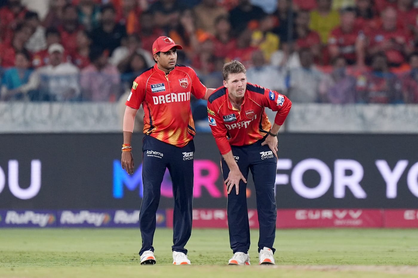 Lockie Ferguson hobbles off two balls into his spell